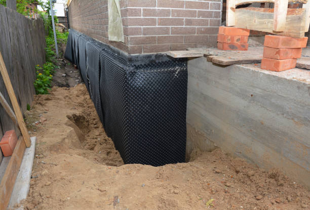 Happy homeowners after waterproofing job in Dousman